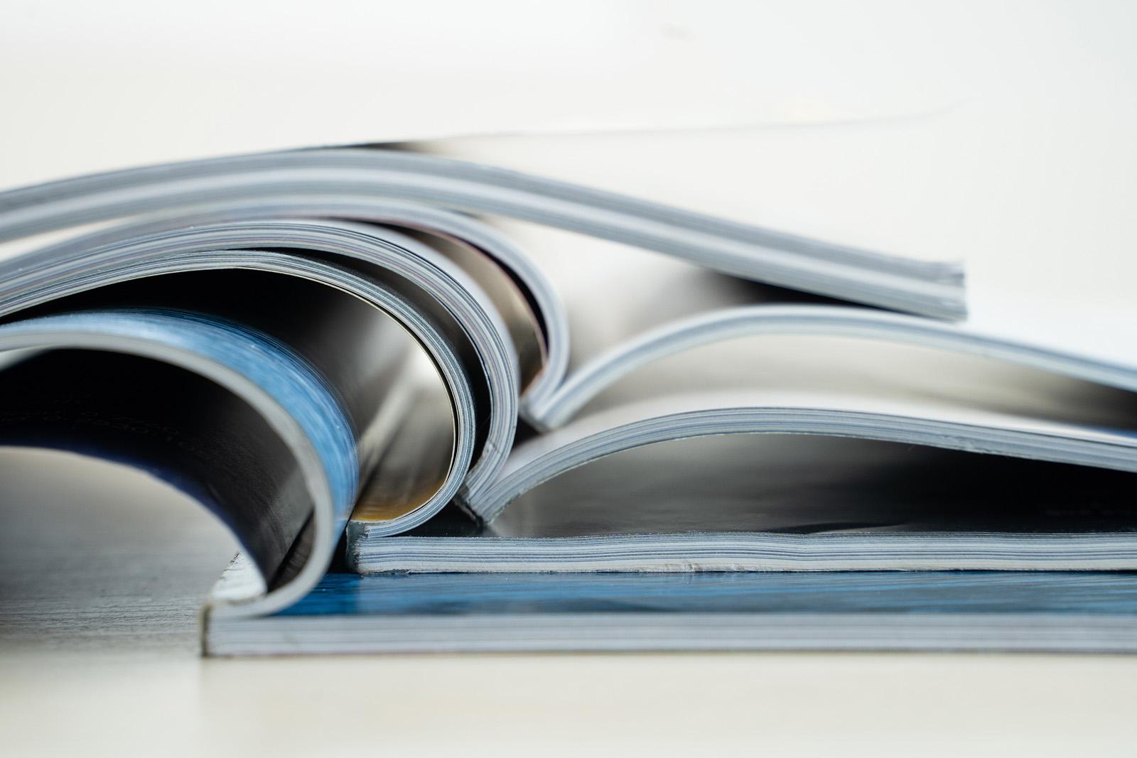 stack of papers and magazines